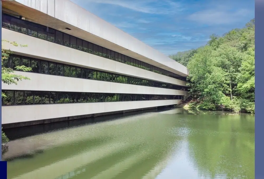 Tributary Center building beside the campus lake